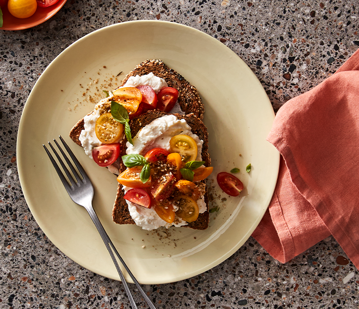 Whipped Ricotta with Sliced Tomato on Cape Seed Toast